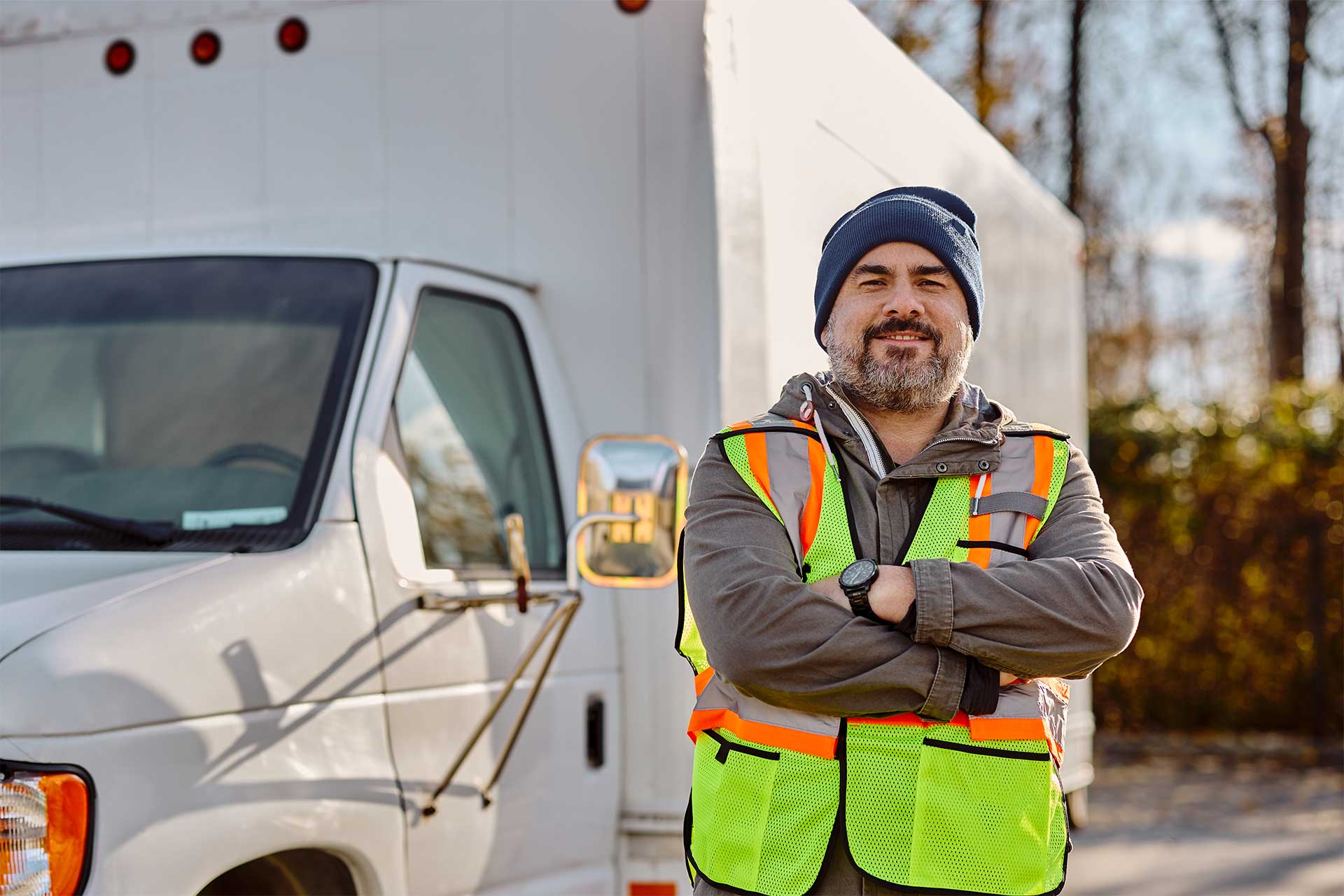 Man standing next to a moving truck